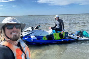 Kiteboarding instructor Jordan Vargas with a student and jet ski in the shallow Laguna Madre near Corpus Christi