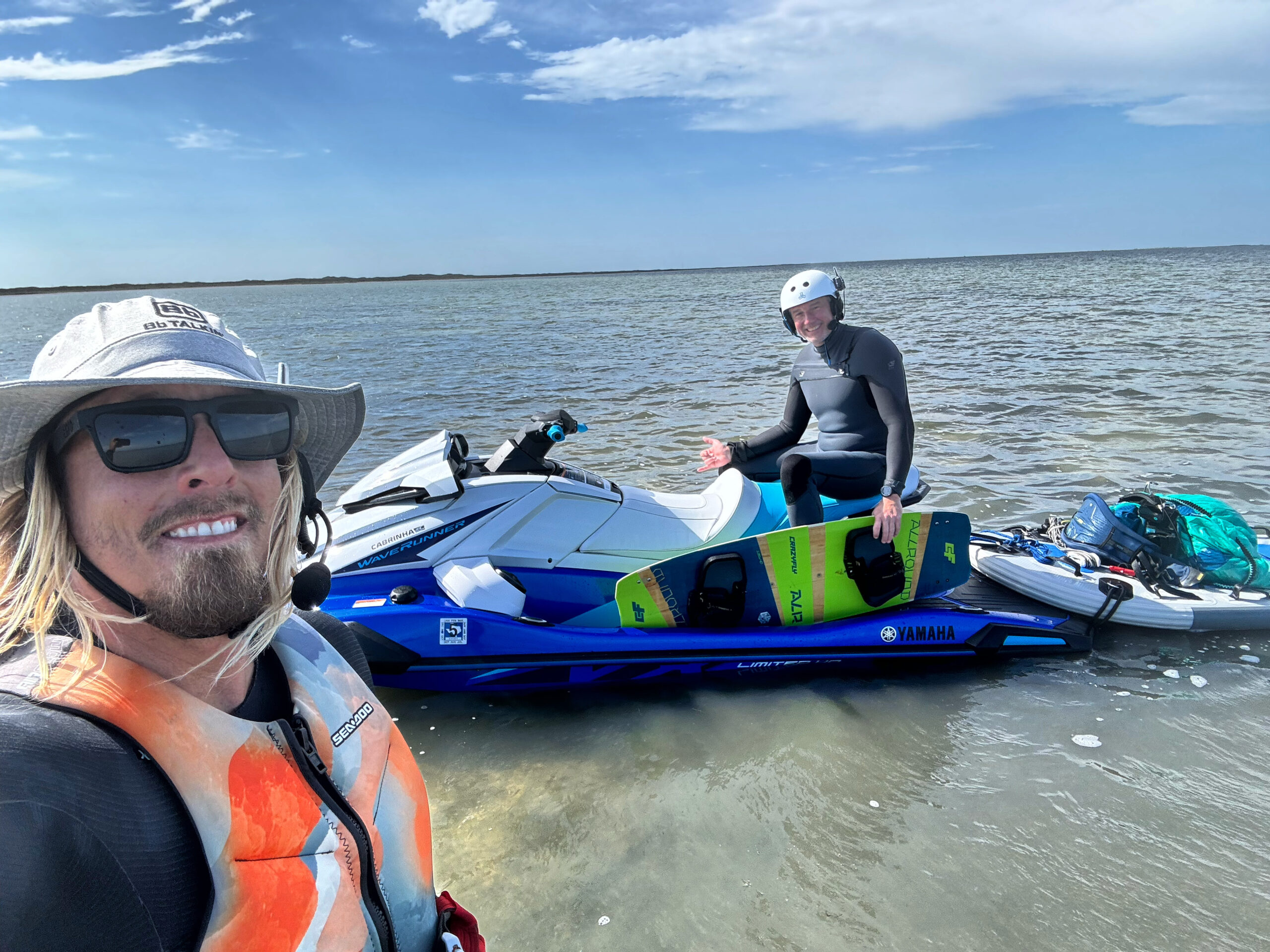 Kiteboarding instructor Jordan Vargas with a student and jet ski in the shallow Laguna Madre near Corpus Christi